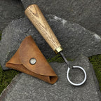This hand-forged carbon steel 52100 knife is a woodworking beginner’s tool. It’s a wood carving scorp knife with a leather case and includes