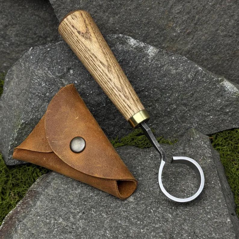 This Scorpion Knife comes with a leather case for carving bowls cups and spoons. It features a hand-forged carbon steel 52100 blade perfect