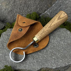 This hand-forged scorpion knife features a carbon steel 52100 blade and comes with a leather case. It’s perfect for bowl, cup carving, spoon